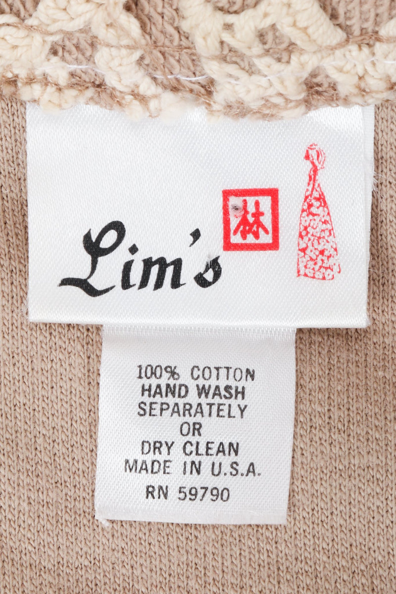 Vintage Lim's label on coat against beige background