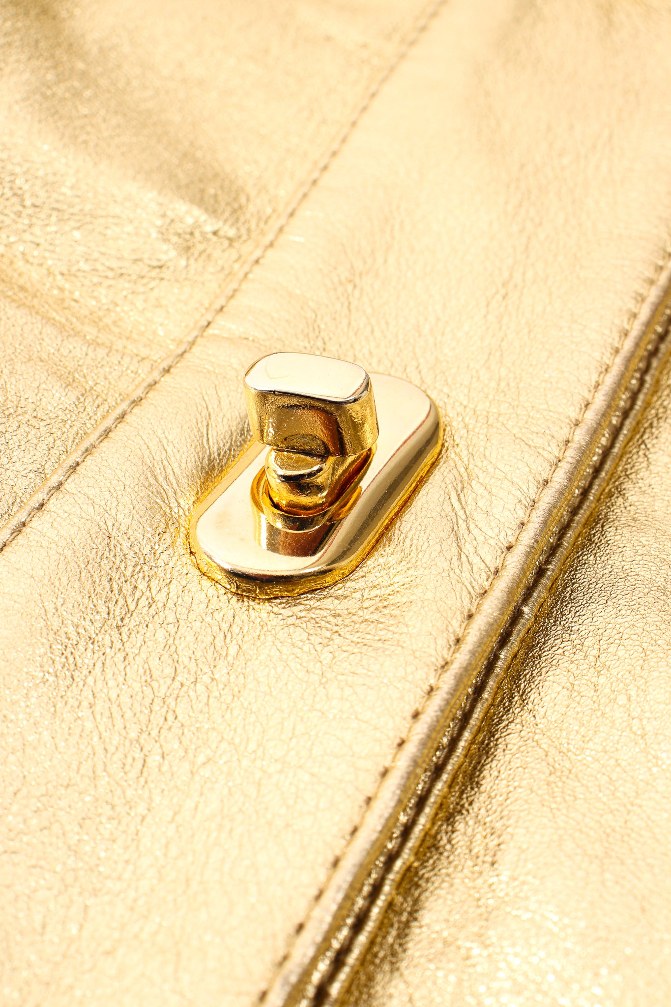 Vintage Suzelle Gold Leather Turnlock Jacket turnlock detail at Recess Los Angeles