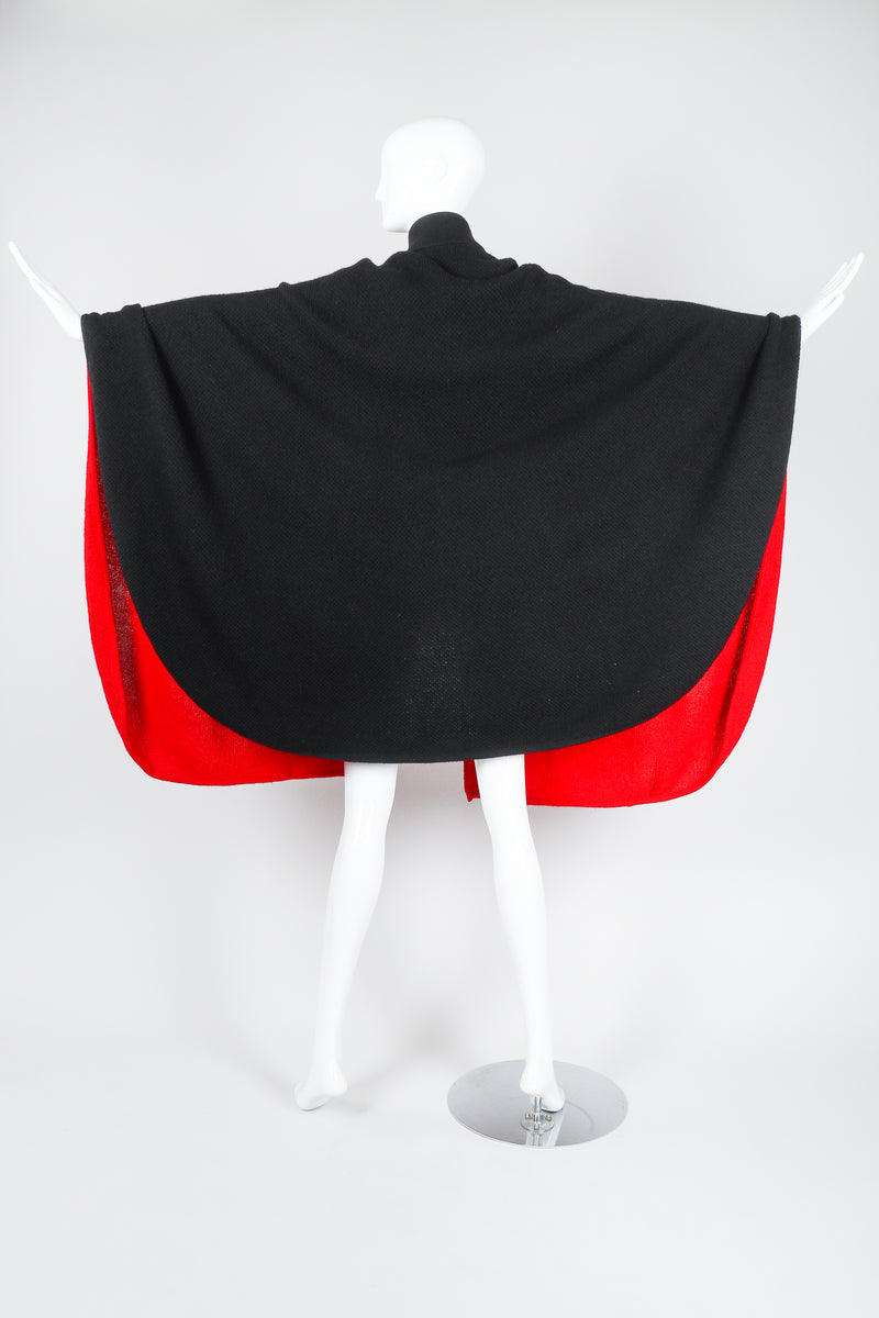Recess Vintage Valentino Red And Black Sweater Knit Cape on Mannequin, back with arms extended