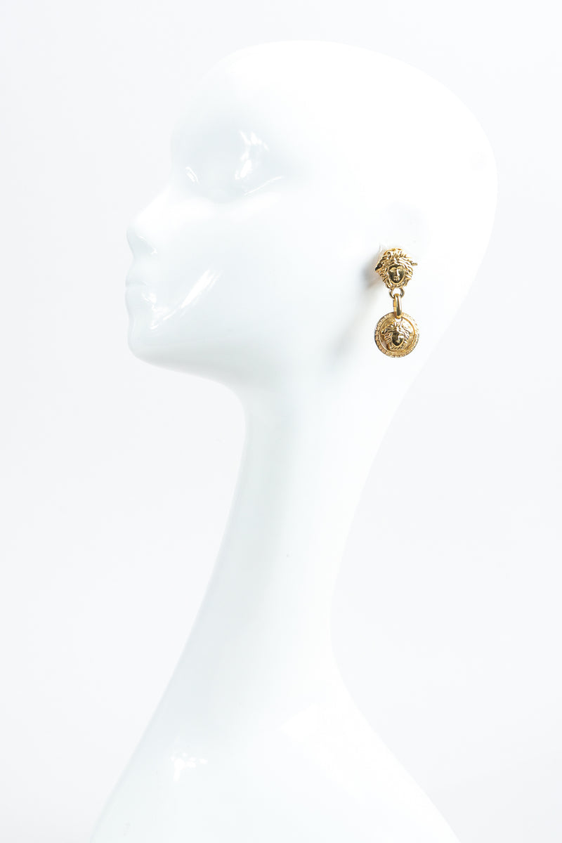 Vintage Gianni Versace Gold Medusa Head Drop Earrings on mannequin at Recess Los Angeles