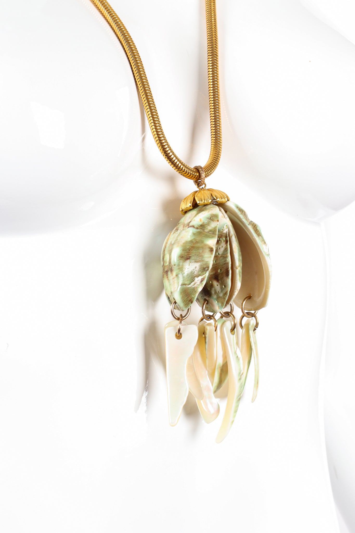 Vintage Unsigned William deLillo Polished Shell Pendant Necklace on mannequin at Recess Los Angeles