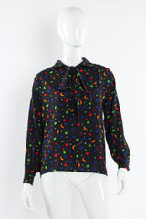 Vintage Saint Laurent 1979 S/S Rainbow Star Moon Blouse mannequin front bow tied @ Recess Los Angeles