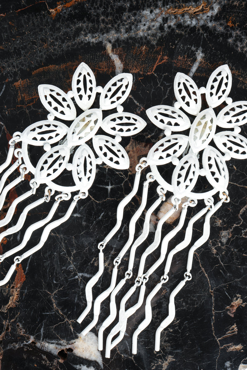 Vintage Yohai White Flower Fringe Earring on petrified wood at Recess Los Angeles