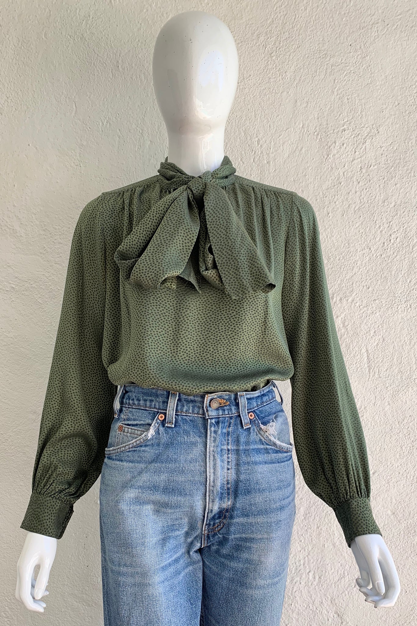 Vintage Yves Saint Laurent YSL Dotted Silk Bow Blouse on Mannequin front crop at Recess