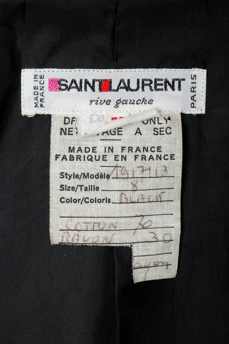 Vintage Yves Saint Laurent YSL label on black fabric