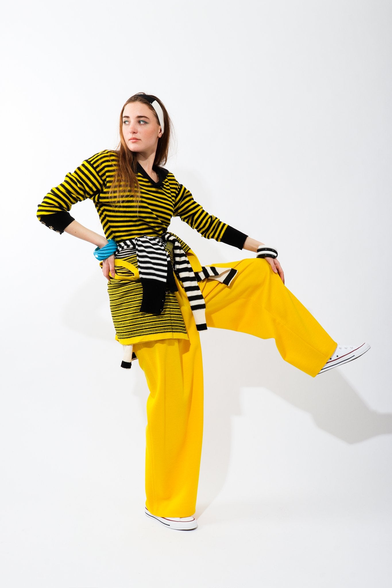 Girl wearing Vintage Sonia Rykiel Yellow Knit Gathered Pant with striped top and sneakers