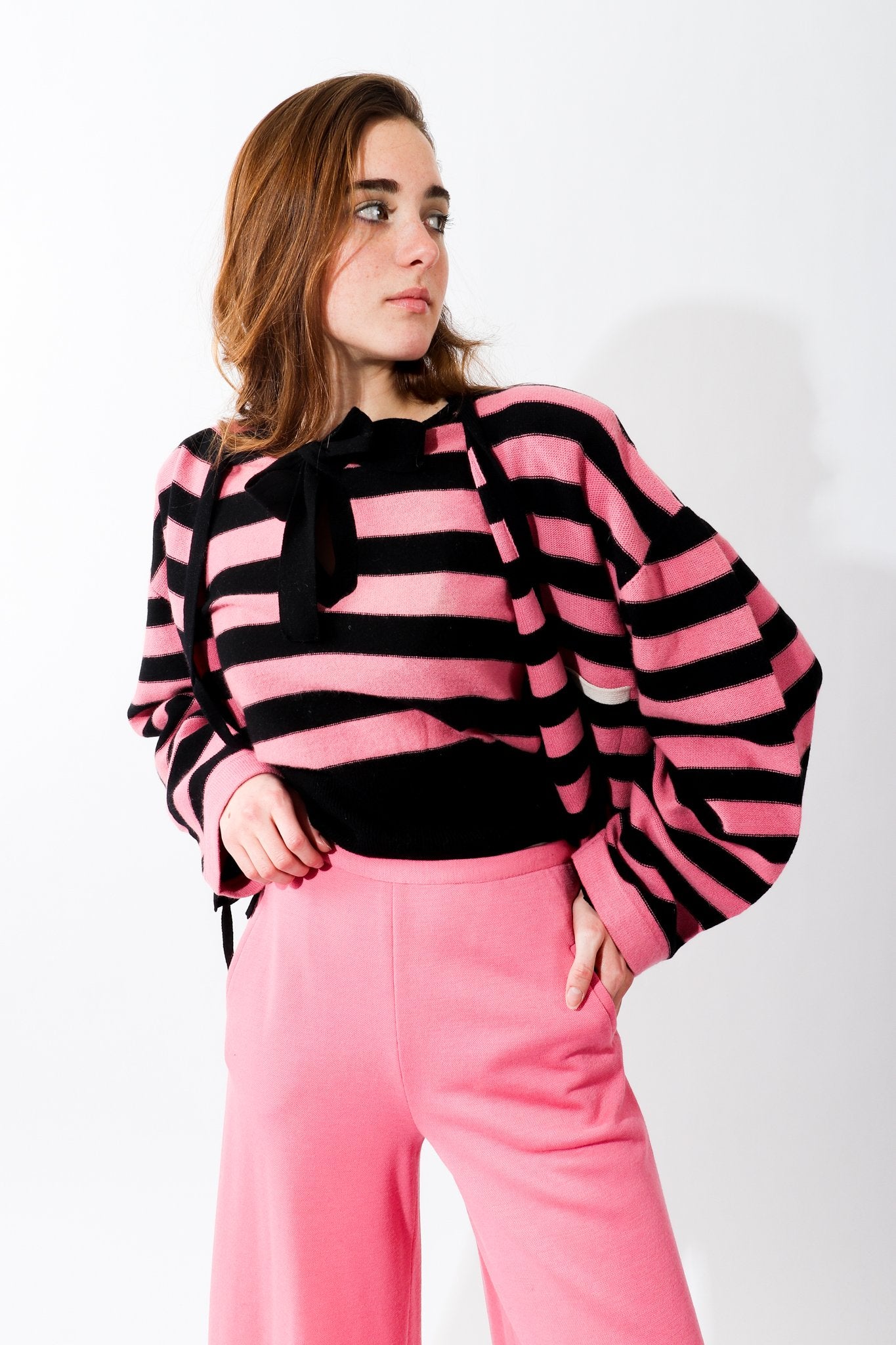 Girl in Vintage Sonia Rykiel Pink Stripe Knit Keyhole sweater and pink pants