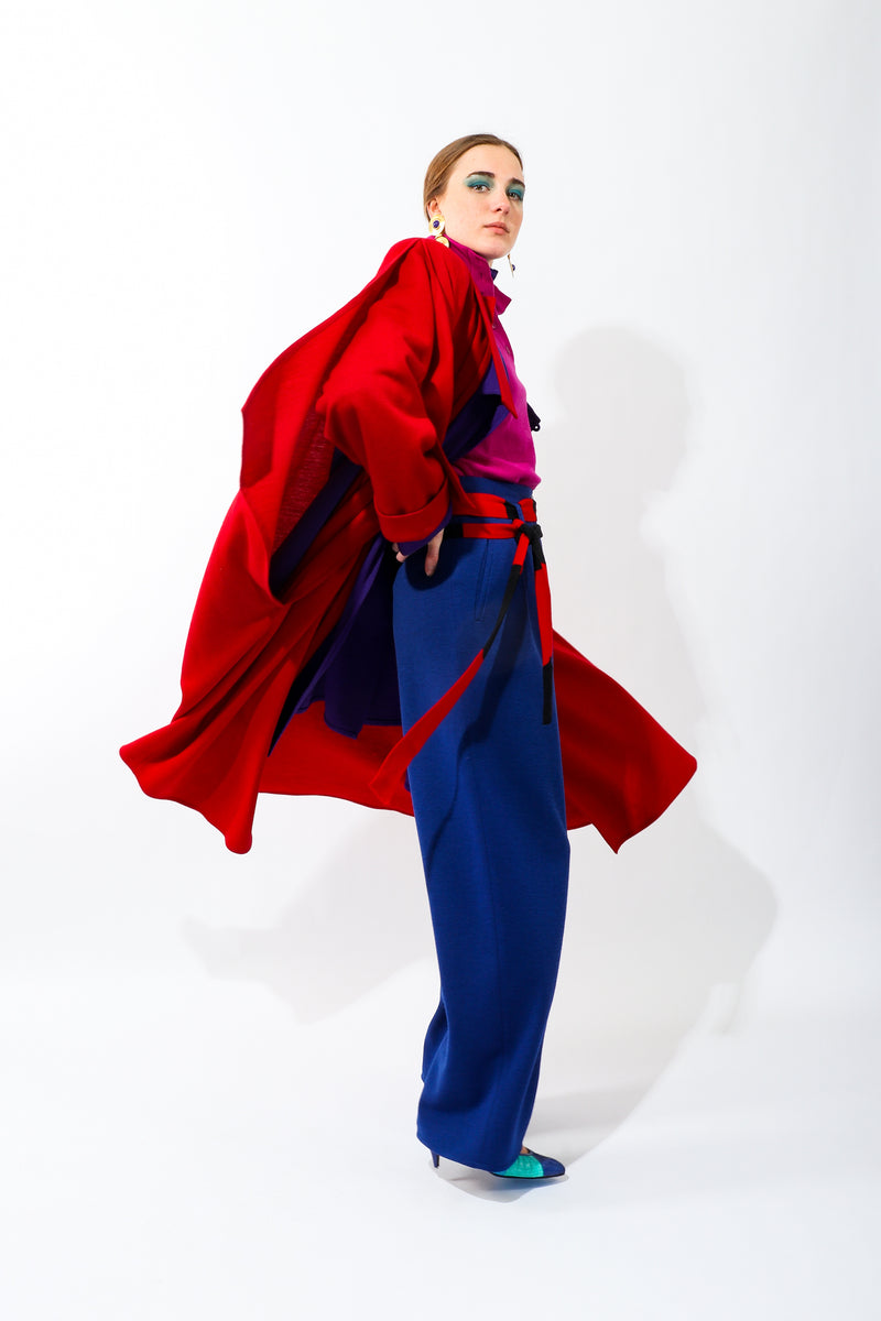 Girl wearing Vintage Sonia Rykiel Blue Knit Pleated Pant with red coat and layers